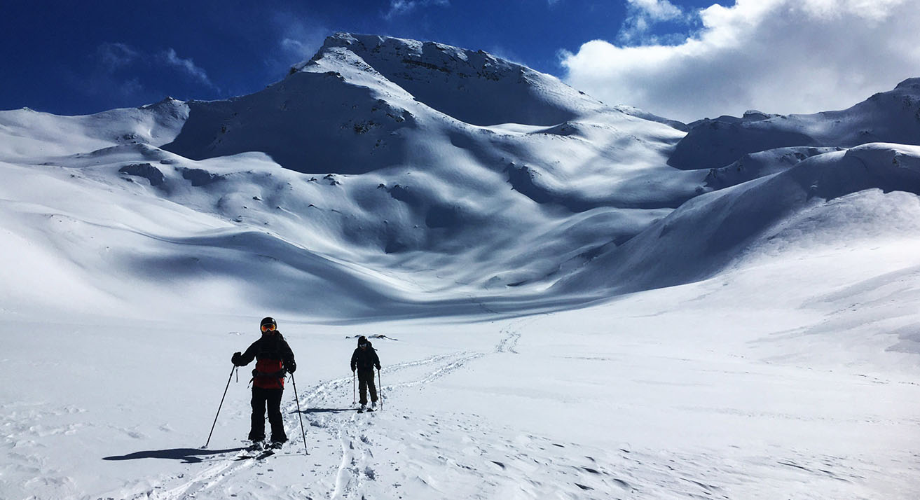 Jonas and Lina ski touring away from the mountains.