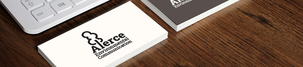 Business cards for Alerce Environmental on a desk.